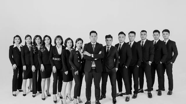 Black and white portrait of a diverse business team in a studio setting.