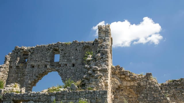Explore the historic ruins with a vibrant blue sky backdrop, perfect for travel enthusiasts.