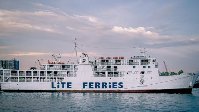 Large Lite Ferry ship docked in Cebu City, Philippines at dusk.