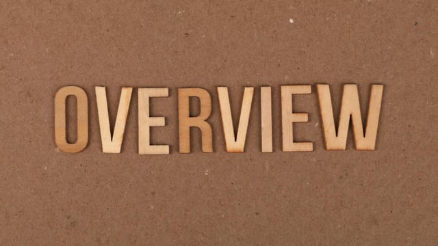 High-resolution image of wooden letters spelling 'OVERVIEW' on a brown background.