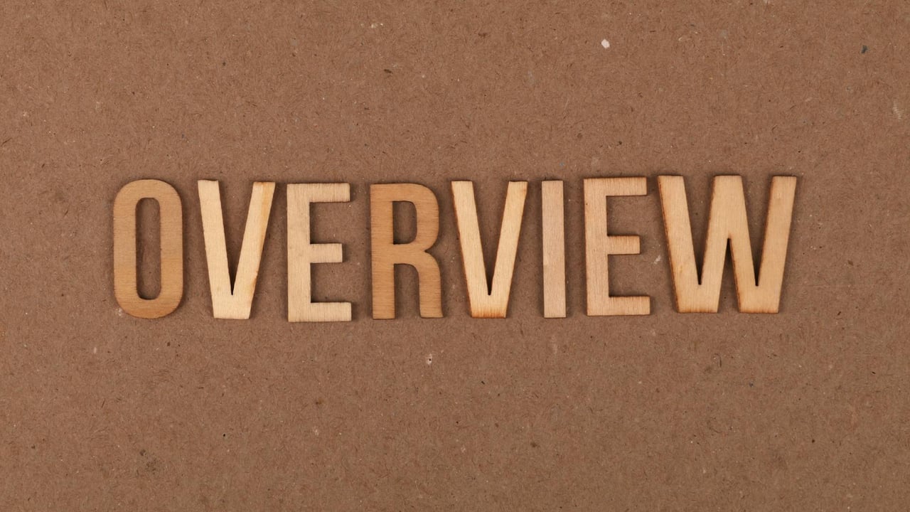 High-resolution image of wooden letters spelling 'OVERVIEW' on a brown background.