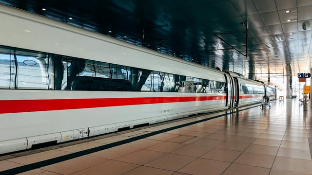 A sleek high-speed train at Frankfurt station, ready for public transport.