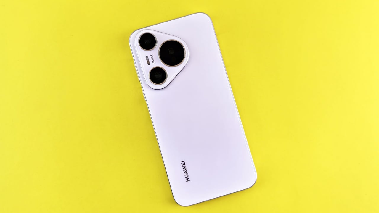 A sleek white smartphone on a vibrant yellow background, showcasing modern technology and design.
