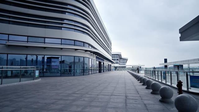 Explore the sleek modern design of Shenzhen's urban architecture. Perfect example of futuristic cityscapes.