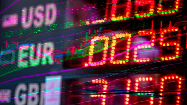 Vibrant stock market display showing exchange rates for USD, EUR, and GBP. Perfect for finance themes.
