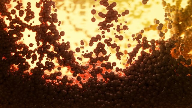 Dynamic abstract image of molecules with vibrant warm tones, highlighting scientific visualization.