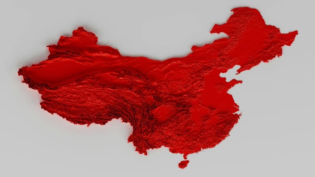 A vibrant 3D relief of China in red, showcasing intricate textures and topographical details.