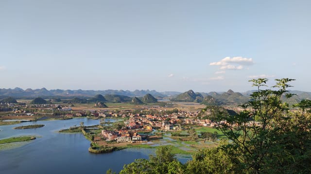 Breathtaking vista of Wenshan Prefecture with mountains, lake, and lush greenery.