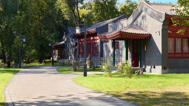 Beautiful view of traditional Chinese architecture in a Moscow park during summer.