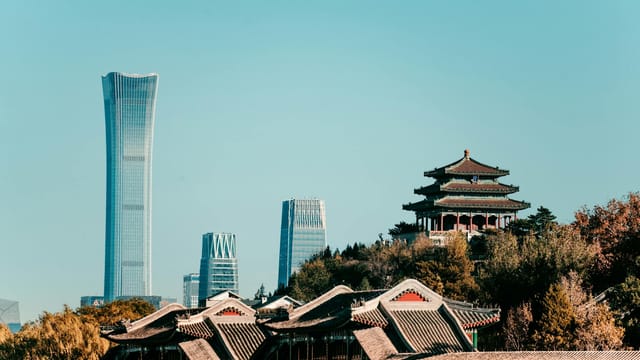 Captivating view of Beijing's skyline featuring traditional architecture and the modern China Zun skyscraper.