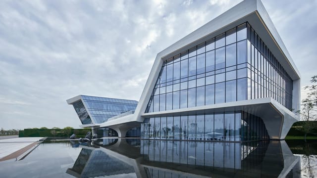 Stunning modern architecture in Sichuan, China, with sleek design and reflective surfaces.