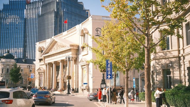 A vibrant street scene in Beijing showcasing historic architecture and modern buildings in beautiful sunlight.