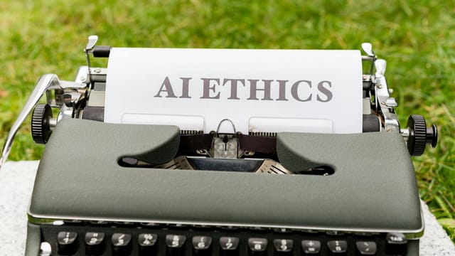 A vintage typewriter outdoors displaying "AI ethics" on paper, symbolizing tradition meets technology.
