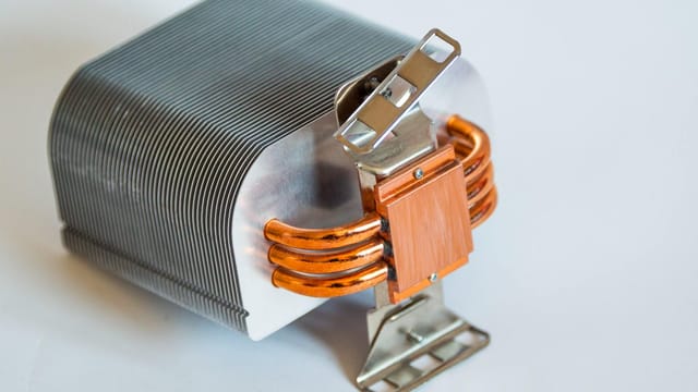 Detailed view of a metallic computer heatsink for cooling systems.