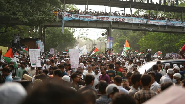 A large pro-Palestine rally in Dhaka, highlighting global solidarity against the Gaza conflict.