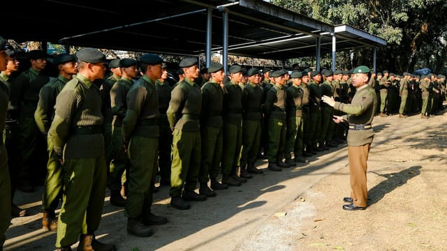 Gurkha soldiers in uniform during a training session in Pokhara, Nepal. Commanding officer addressing the troops.