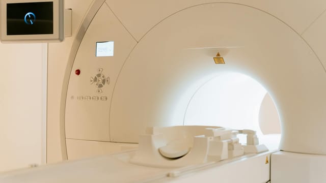 Close-up view of a modern CT scanner in a healthcare facility.