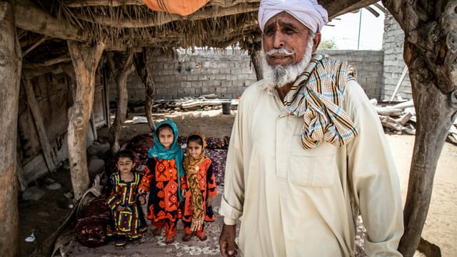 A family portrait showcasing traditional attire and lifestyle in Chabahar, Iran.