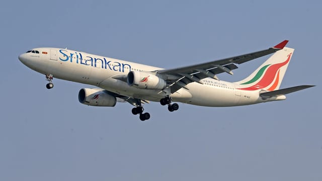 SriLankan Airlines Airbus A330 flying in clear skies, showcasing aviation technology.