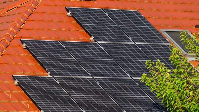 Illustrative image: Close-up of solar panels on a red tiled roof in Croatia, highlighting renewable energy.