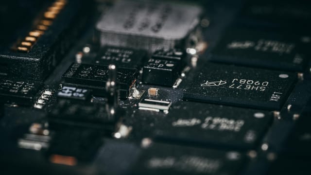 Detailed macro shot of electronic circuit components showcasing intricate design and layout.