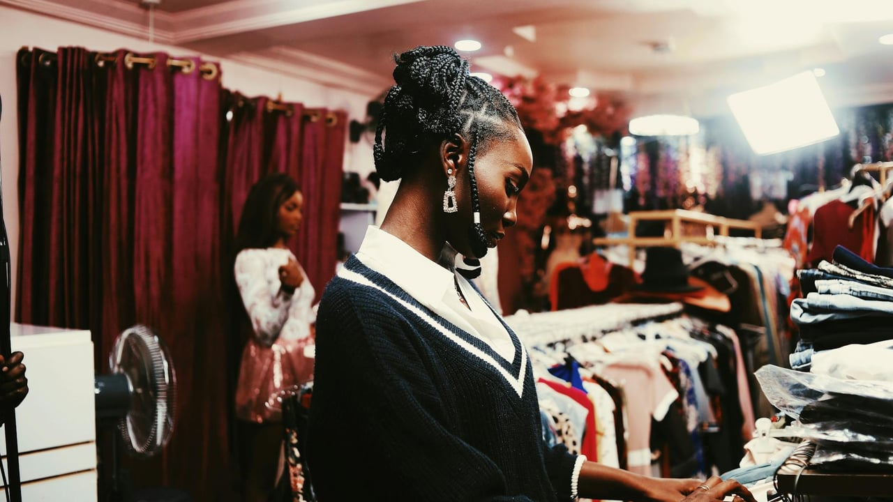 Two women shopping in stylish Abuja boutique. Fashion, elegance and modern trends.