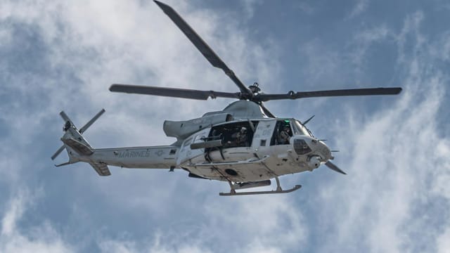 US Marine Bell UH-1Y Venom helicopter flying during the Miramar Airshow in San Diego.