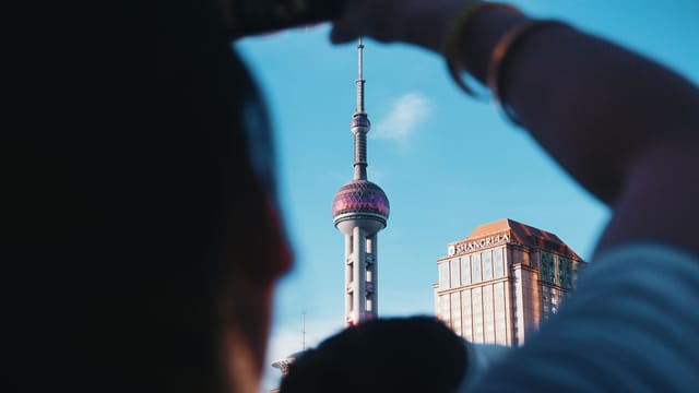 A unique view of the Pearl Tower taken from street level in Shanghai, China.
