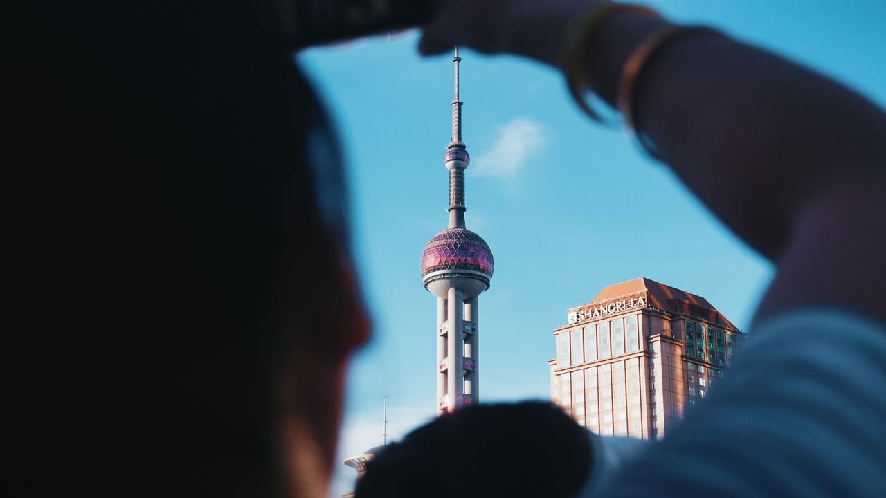 A unique view of the Pearl Tower taken from street level in Shanghai, China.