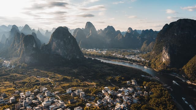 Discover the breathtaking aerial view of karst mountains and lush countryside in Guilin, Guangxi, China.