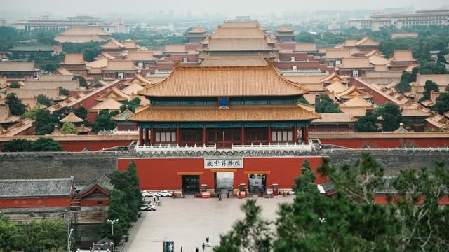 Stunning aerial shot of the Forbidden City in Beijing, showcasing traditional Chinese architecture and cultural heritage.