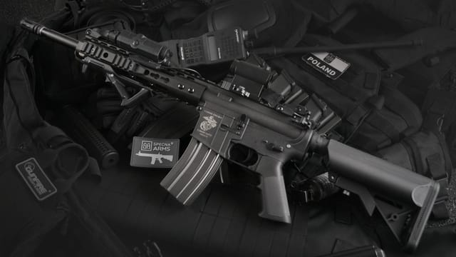 Detailed view of military rifles and tactical equipment, showcasing precision.