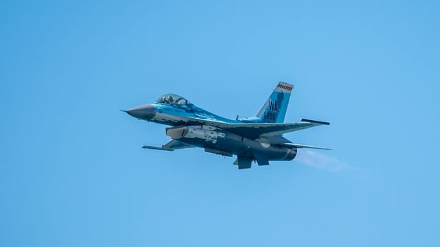 An F-16 Fighting Falcon performs in clear skies at the Pacific Airshow in Huntington Beach.