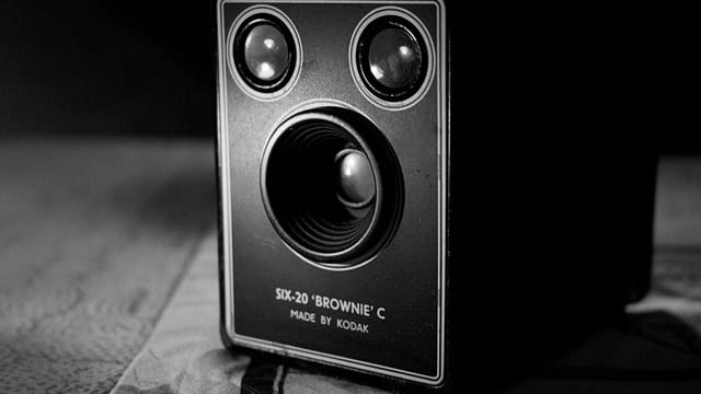 Close-up of a vintage Kodak Six-20 Brownie C box camera in black and white.