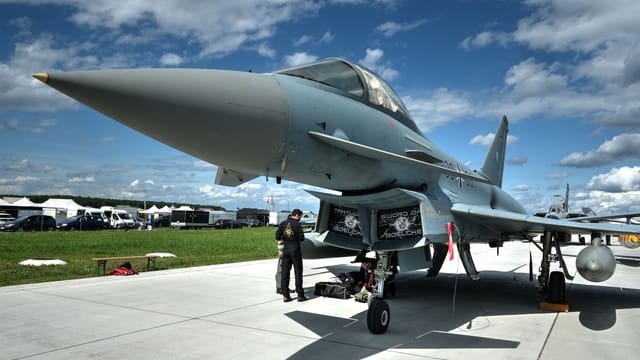 Eurofighter Typhoon fighter jet exhibited outdoors at Slovak aviation event.