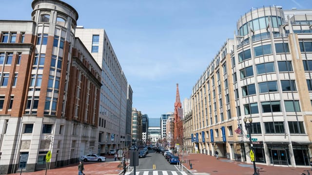 Urban street view of Washington D.C.'s architecture highlighting historic and modern buildings.