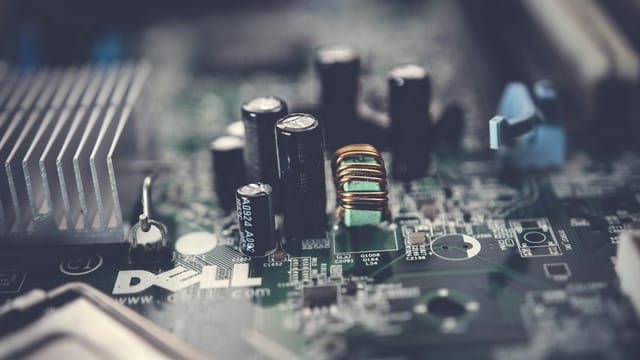 Detailed close-up of a motherboard showcasing electronic components and circuits.