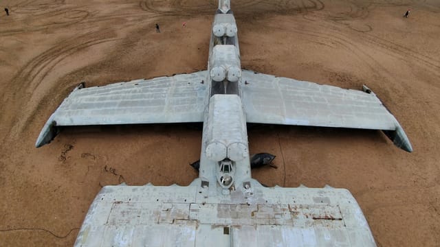 Aerial shot of the Lun-class ekranoplan resting in a Dagestan desert, showcasing its innovative Soviet design.