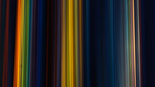 Colorful vertical stripes create a vibrant abstract pattern, ideal for artistic backgrounds or wallpapers.
