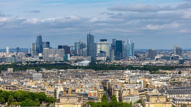 Aerial view of La Défense skyline in Paris with urban architecture and cityscape.