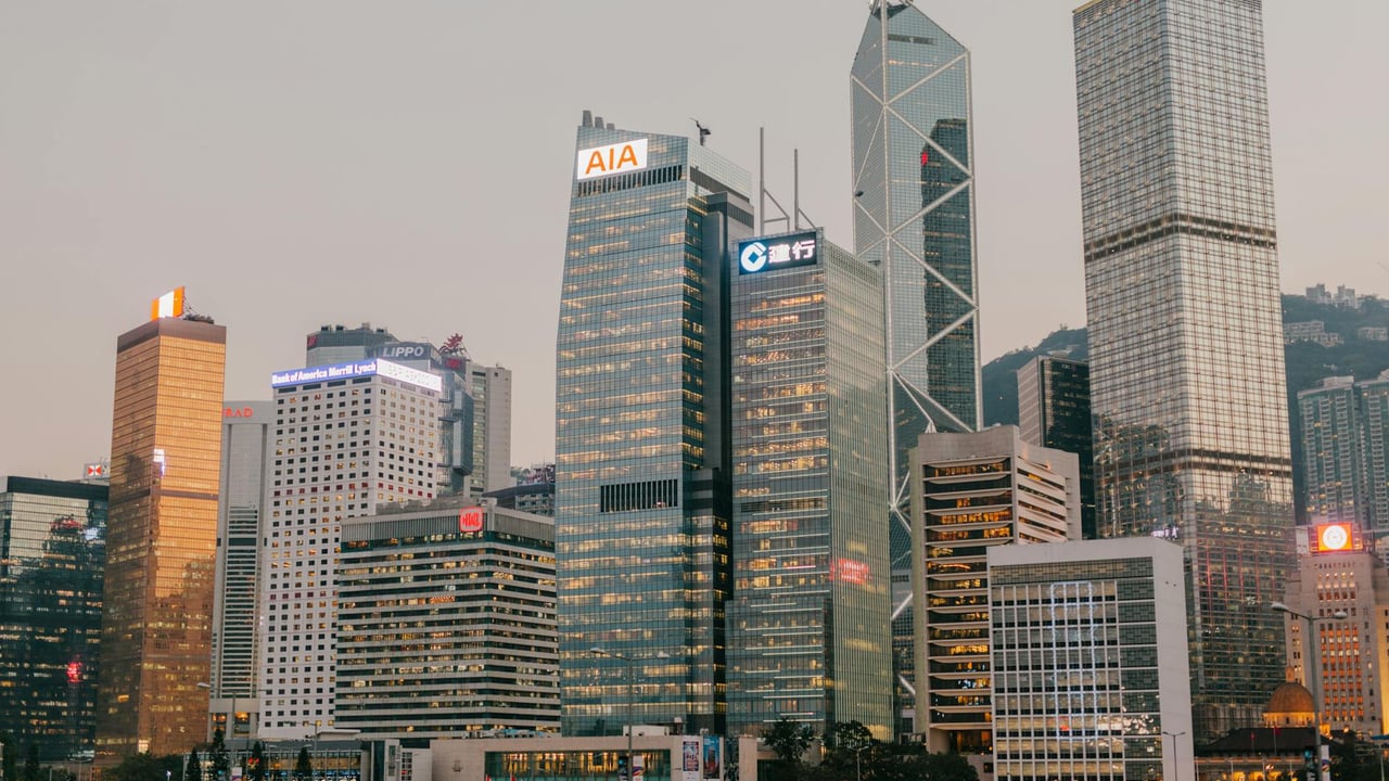 Stunning view of Hong Kong's iconic skyscrapers during twilight, capturing the city's urban glow.