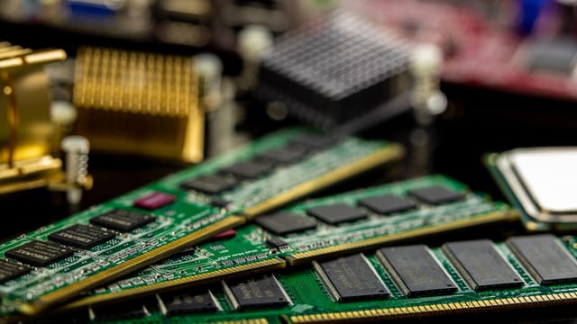 Detailed view of RAM sticks and microprocessors on a motherboard.