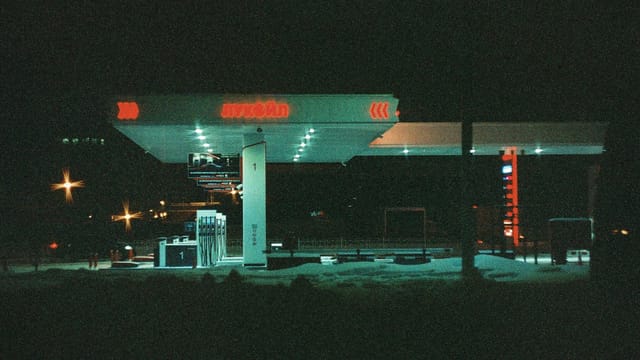 Atmospheric night view of an illuminated gas station in Saint Petersburg, Russia.