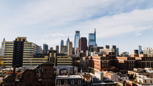 A stunning view of Philadelphia's modern skyline with iconic skyscrapers under a clear blue sky.