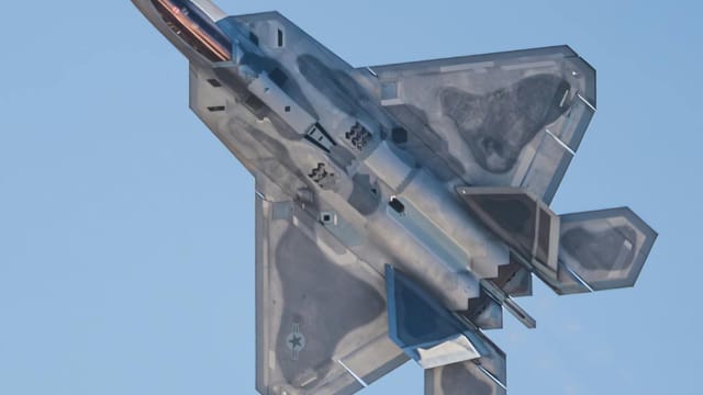 F-22 Raptor military jet showcasing maneuvers at the San Diego Airshow.