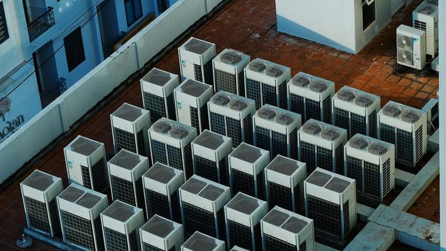 High angle view of rooftop HVAC units on a building in Buon Ma Thuot, Vietnam.