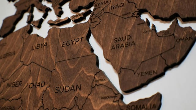 Detailed wooden jigsaw map featuring countries from North Africa and the Middle East.
