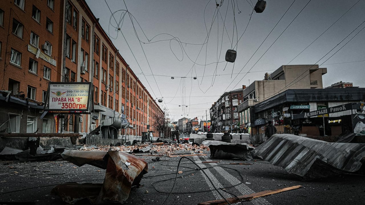 A city street in Kyiv is left in ruins, showcasing debris and destruction in an urban environment.