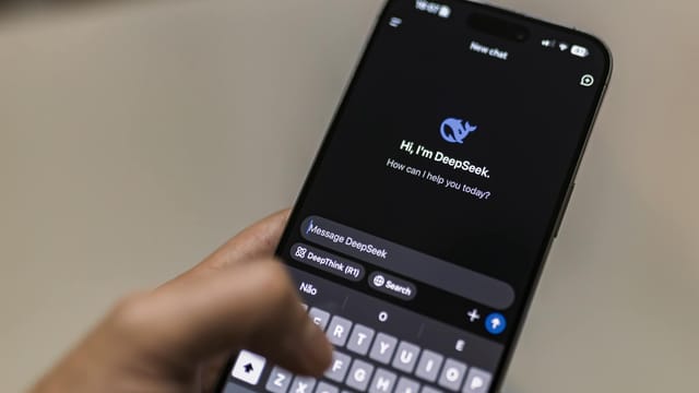A smartphone displaying the DeepSeek AI chat interface, depicting modern technology use.