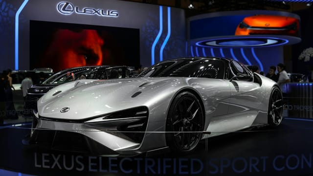Lexus Electrified Sport Concept car showcased at an indoor auto exhibition with modern lighting.